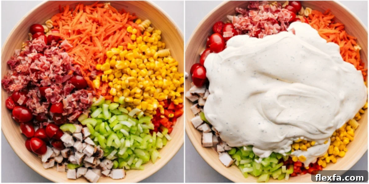 Delicious Chicken Pasta Salad Recipe Assembly All the delicious toppings being carefully added over a bed of pasta, with the creamy dressing drizzled over everything for this easy chicken pasta salad recipe.