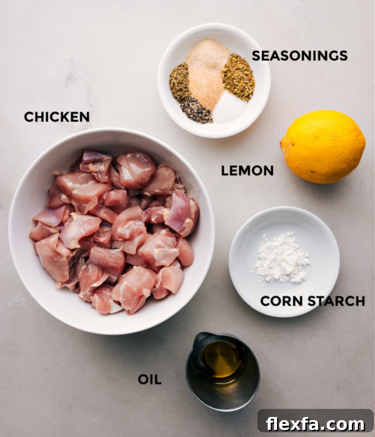 Key Ingredients for Delicious Greek Chicken Bowls All the fresh ingredients for Greek Chicken Bowls beautifully prepped and laid out for easy assembly, showcasing vibrant colors and textures.