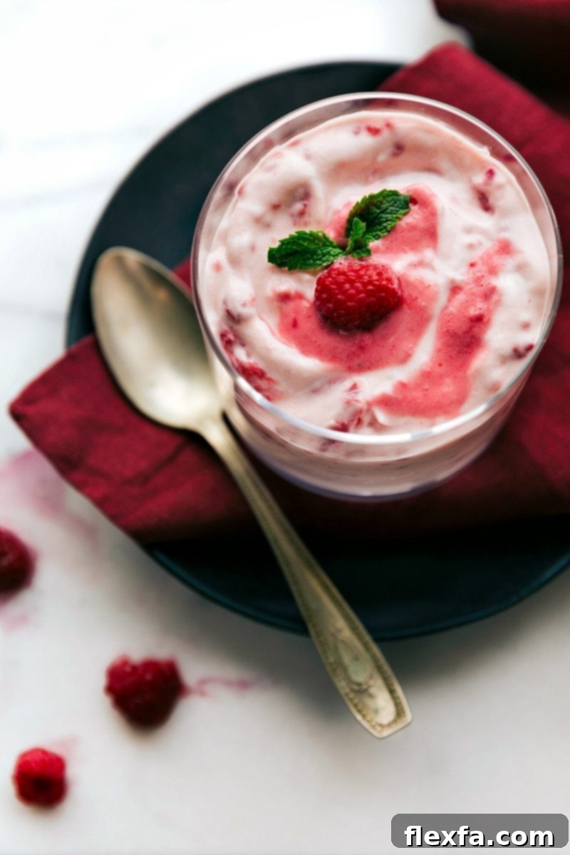 Close-up overhead view of Raspberry Fluff in a serving dish, showcasing its creamy texture and pink color