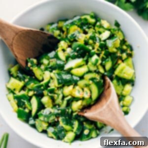 A vibrant bowl of Smashed Cucumber Salad, showcasing its fresh ingredients and inviting texture, ready to be enjoyed.