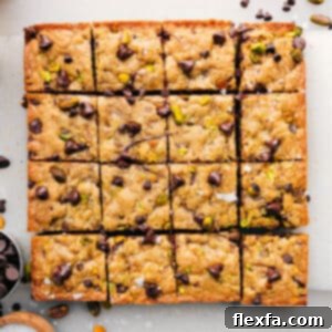 A perfectly baked blondie bar with chocolate chips and nuts.