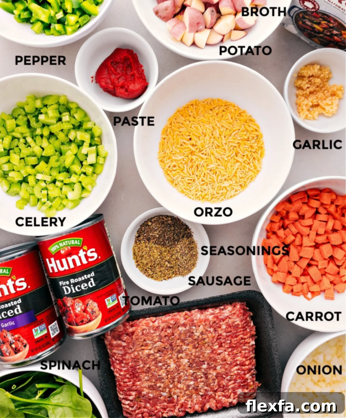 A vibrant selection of fresh ingredients for Italian Sausage Orzo Soup, including tender orzo pasta, savory ground Italian sausage, a colorful medley of chopped vegetables, rich beef broth, and a variety of aromatic seasonings, all meticulously prepped and ready for assembly.