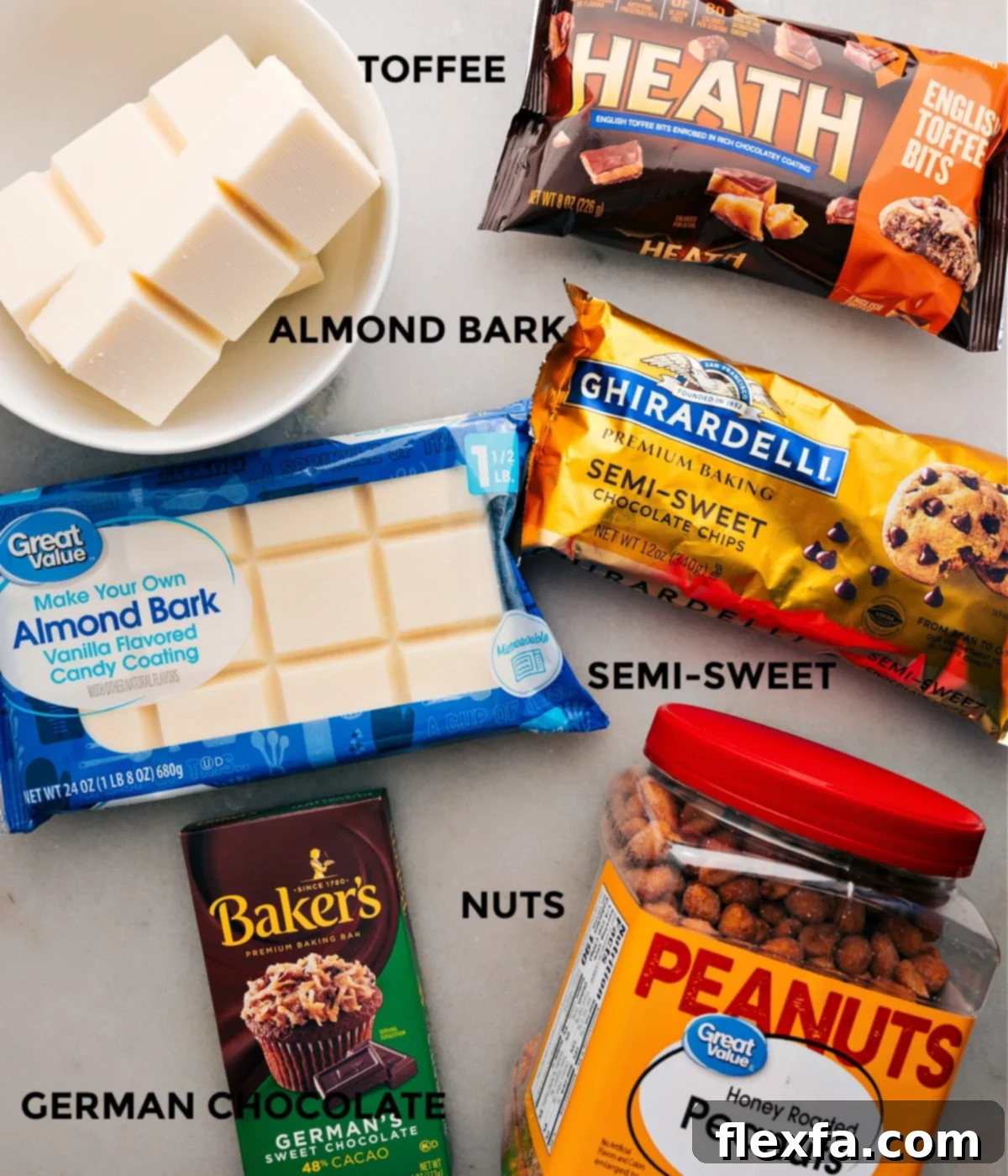Key ingredients for Crockpot Candy laid out: blocks of vanilla almond bark, various chocolate chips, a German chocolate bar, and a large bag of honey-roasted peanuts.