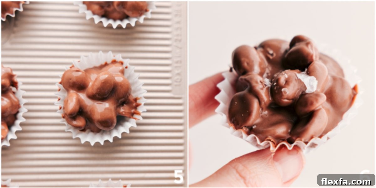 Freshly scooped Crockpot Candy in mini muffin cups, generously topped with flaky sea salt, cooling on a tray.