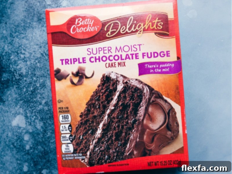 A box of Betty Crocker Super Moist Triple Chocolate Fudge cake mix, ready to be used in the recipe.