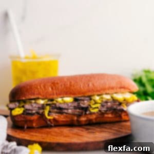 Close-up of a delicious Italian Beef Sandwich with dripping au jus.