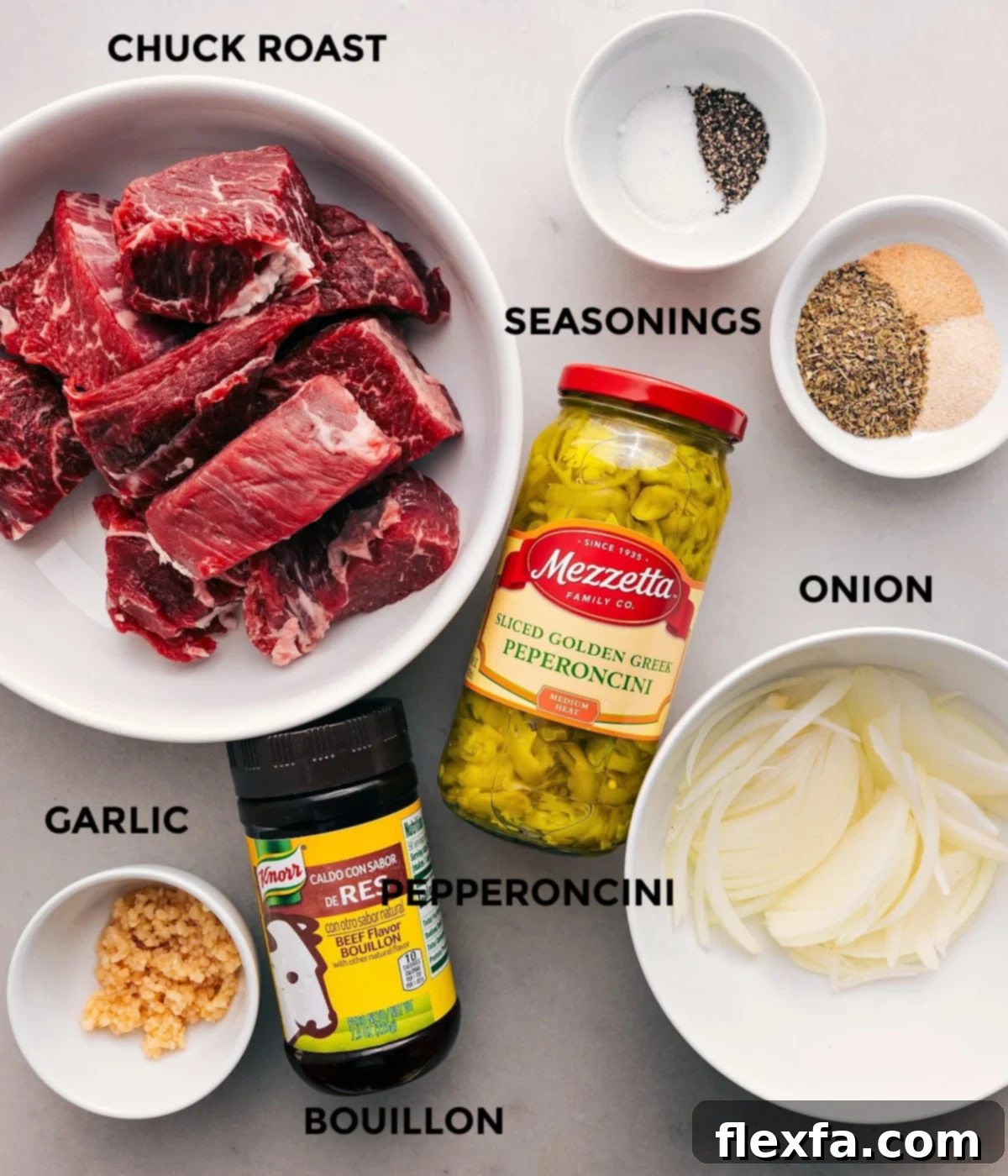 Key Ingredients For Italian Beef Sandwich All the essential ingredients for a delicious Italian Beef Sandwich laid out: beef chuck, pepperoncini, onion, various seasonings, garlic, and beef bouillon.