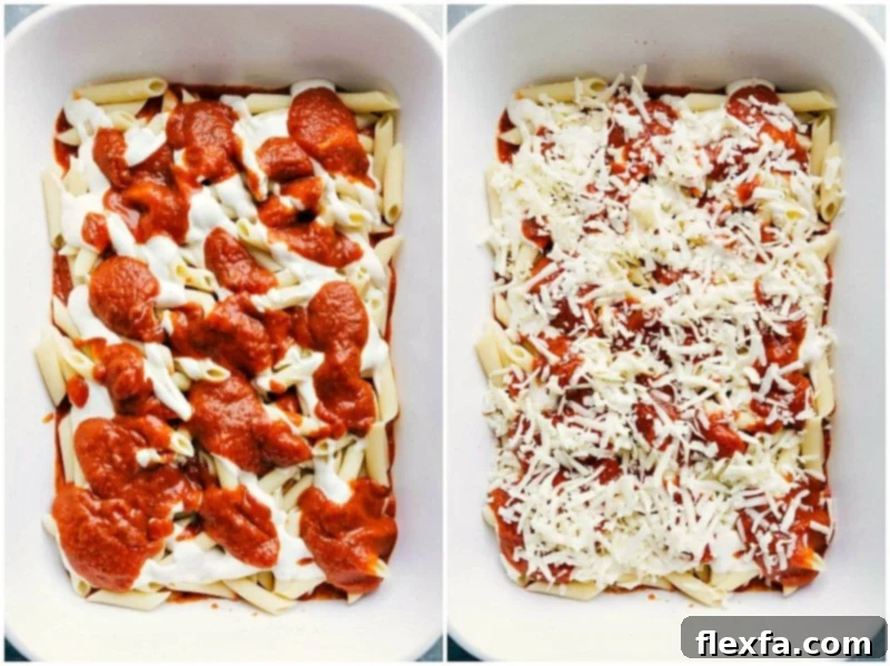 Pasta with red and white sauces being added, topped off with a generous sprinkle of mozzarella cheese.