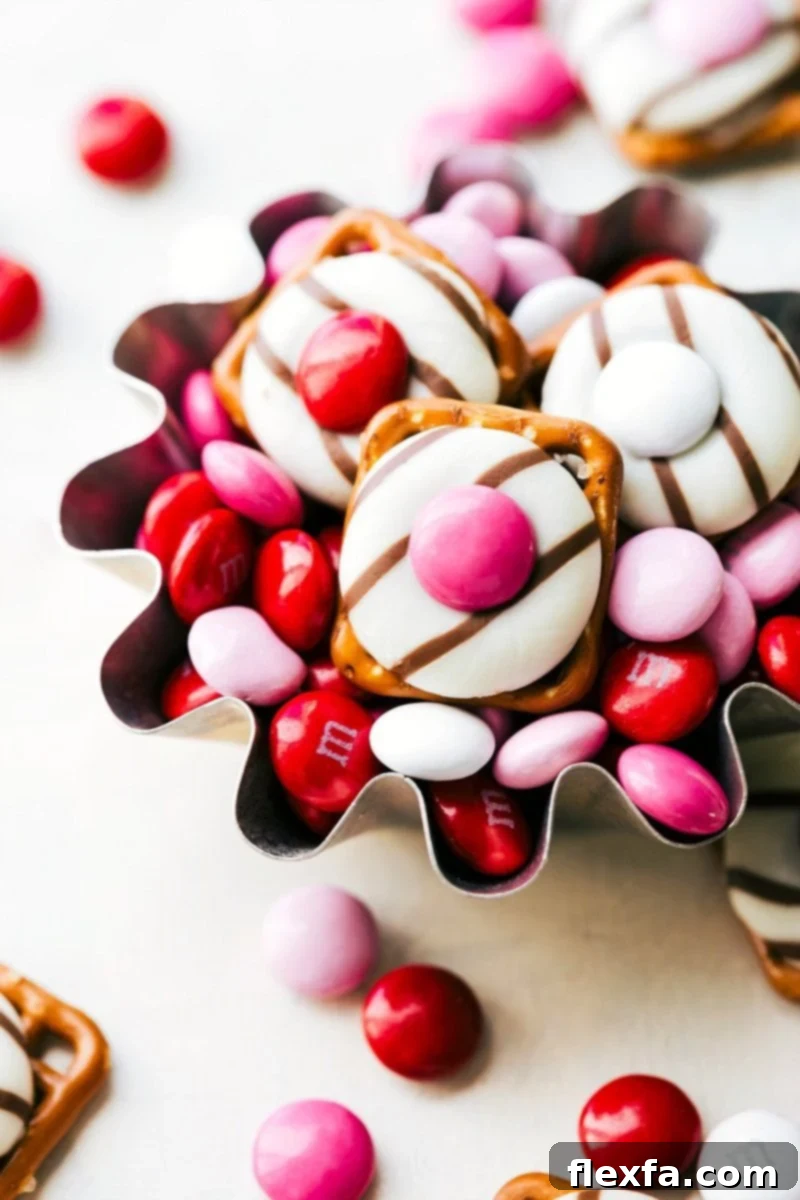 Sweet & Simple Valentine Surprises 3 Heart Hug Pretzels, Love Fortune Cookies, Mini Valentine Bear, White Chocolate Heart Pretzels spread out beautifully for Valentine's Day