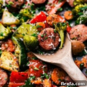 Effortless Italian Sausage and Roasted Vegetables 3 A spoonful of the finished meal, showcasing a bite full of flavor and texture, ready to be enjoyed.