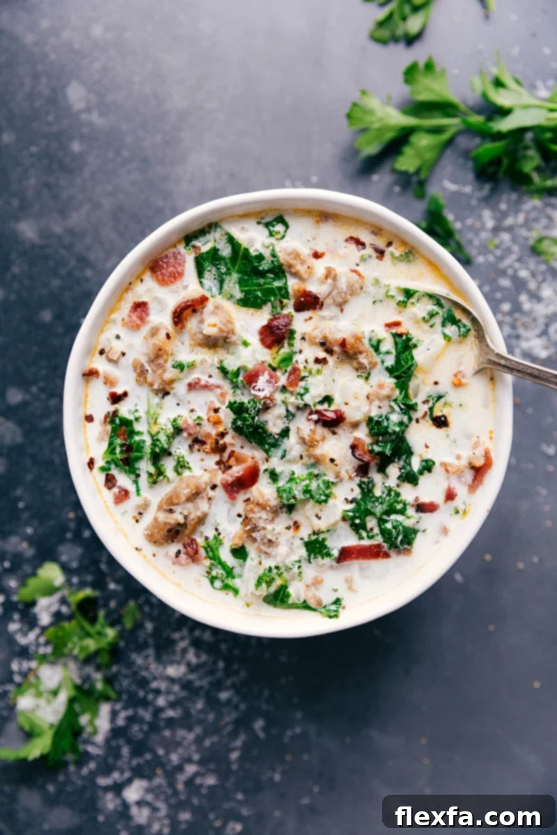 Delicious Easy Zuppa Toscana Soup with Fresh Herbs and Bacon A steaming bowl of easy Zuppa Toscana soup, generously topped with fresh parsley and crispy bacon bits, ready to be enjoyed.