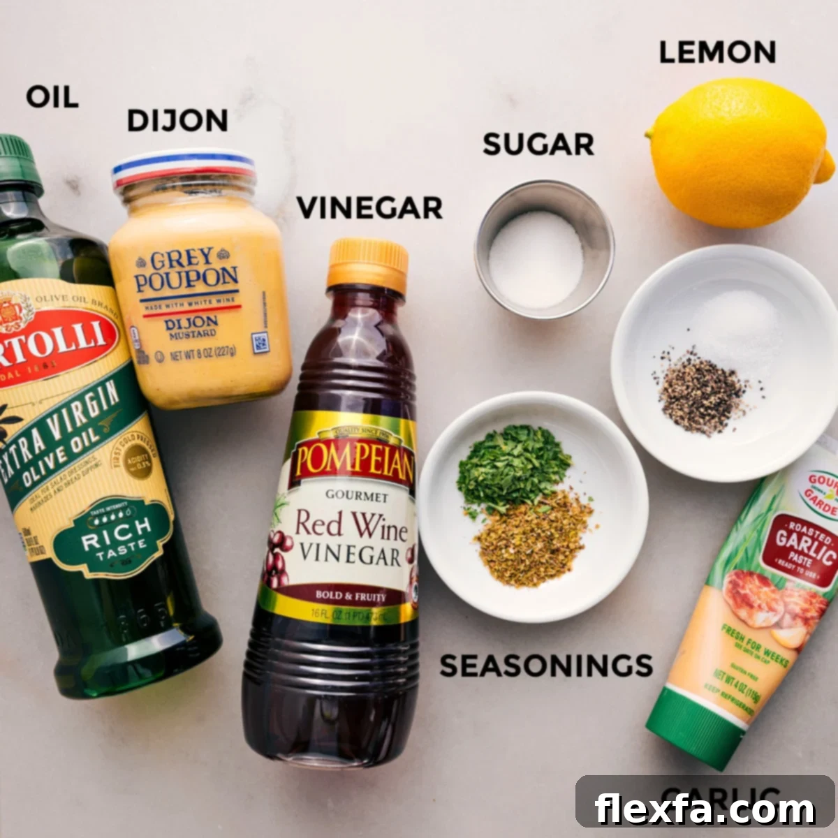 How To Make The Dressing For Dense Bean Salad All the dressing ingredients for the dense bean salad neatly arranged: olive oil, Dijon mustard, red wine vinegar, granulated sugar, dried oregano, dried parsley, minced garlic, and fresh lemon.
