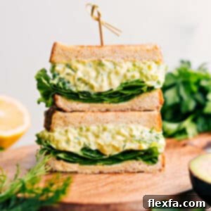 Close-up of creamy avocado egg salad with fresh parsley garnish, ready to be served.