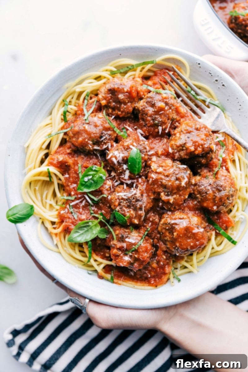 Cheesy Heart Meatballs 2 Delicious cheese stuffed meatballs generously coated in homemade marinara sauce, served over spaghetti