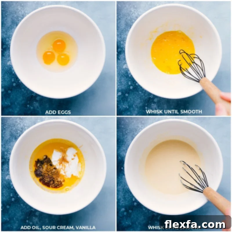 Wet ingredients for the cake mix cupcakes being whisked together in a bowl.