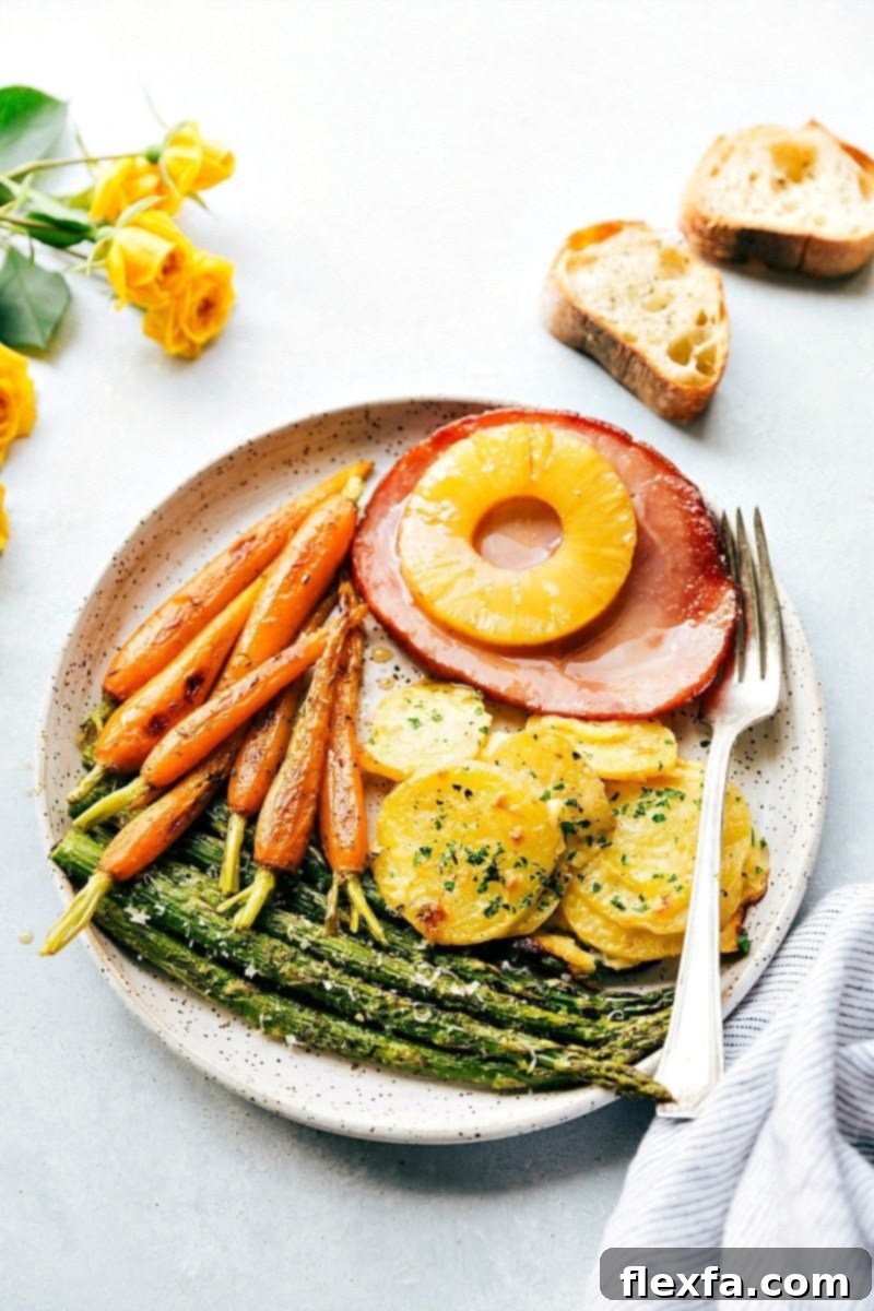 Best Easter dinner ideas: a complete meal plated and ready to enjoy. A perfectly portioned plate of the Easter dinner, showing all the elements together with a fork beside it.