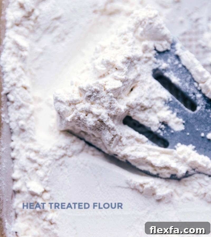 Preparing Flour for Heat Treatment for Safe Edible Brownie Dough Close-up of all-purpose flour in a metal bowl, ready for heat treatment.