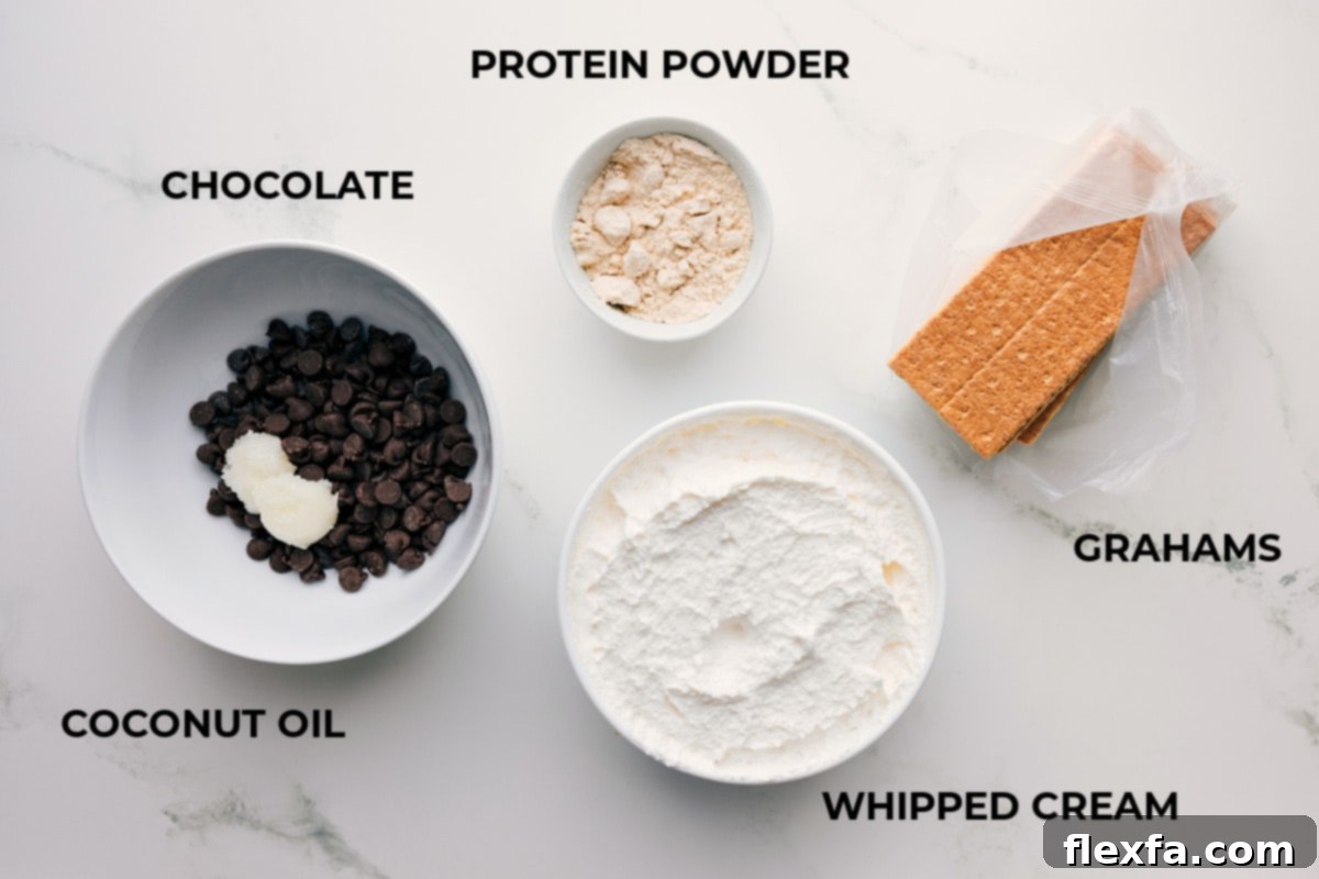 Ingredients In Frozen Protein S'mores All ingredients laid out for making Frozen Protein S'mores: graham crackers, whipped topping, vanilla protein powder, chocolate chips, and coconut oil.