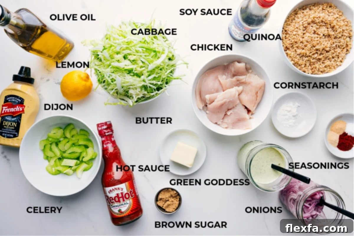 All the ingredients prepped for easy assembly, including olive oil, cabbage, chicken, soy sauce, quinoa, cornstarch, seasonings, dressing, onions, butter, hot sauce, celery, Dijon, and lemon.