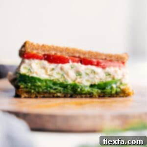 Avocado Tuna Bliss 3 The finished Tunacado sandwich, sliced diagonally and presented beautifully on a cutting board.