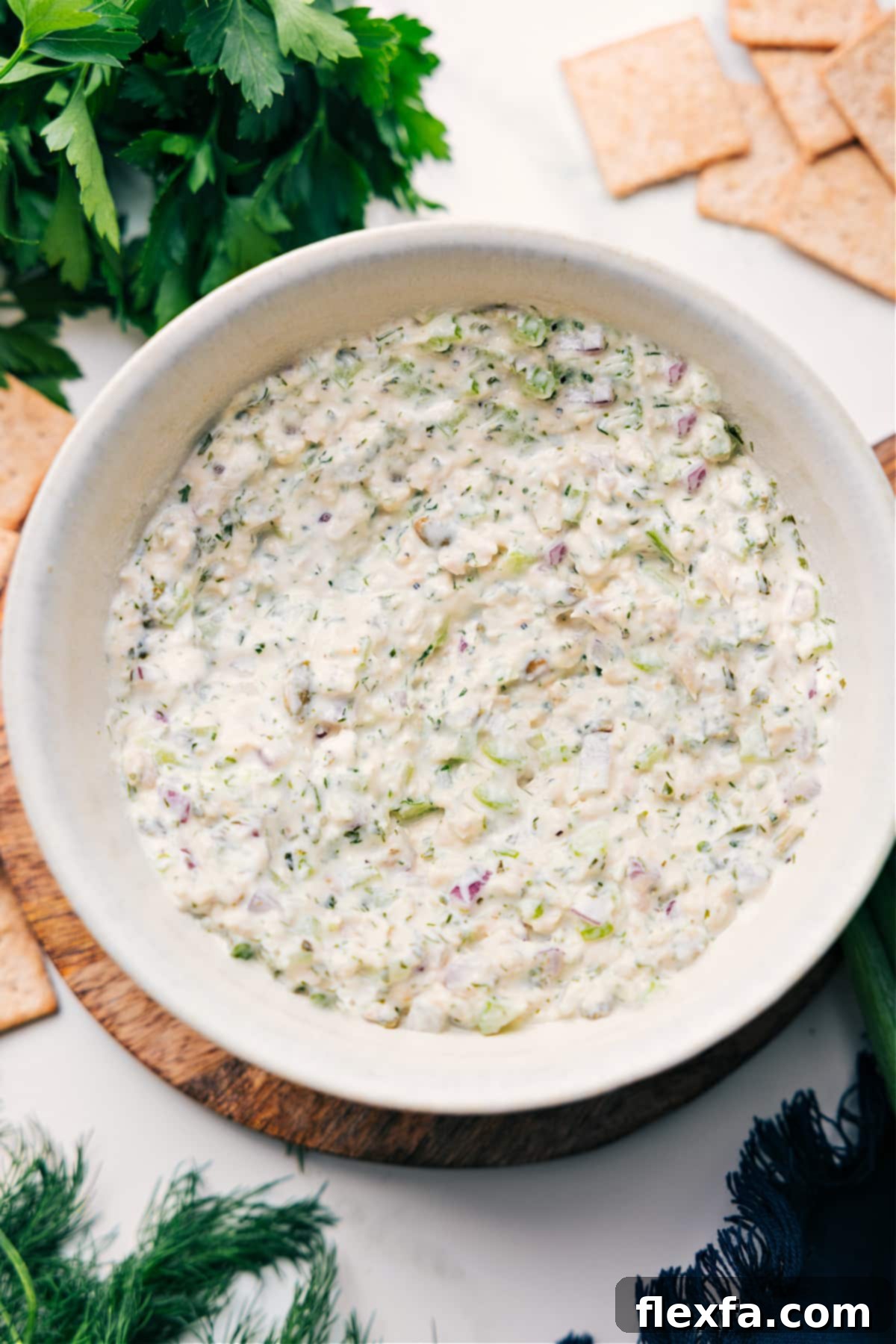 Fresh And Delicious Green Goddess Chicken Salad A beautifully presented bowl of Green Goddess Chicken Salad, vibrant with fresh herbs and ready to be enjoyed.