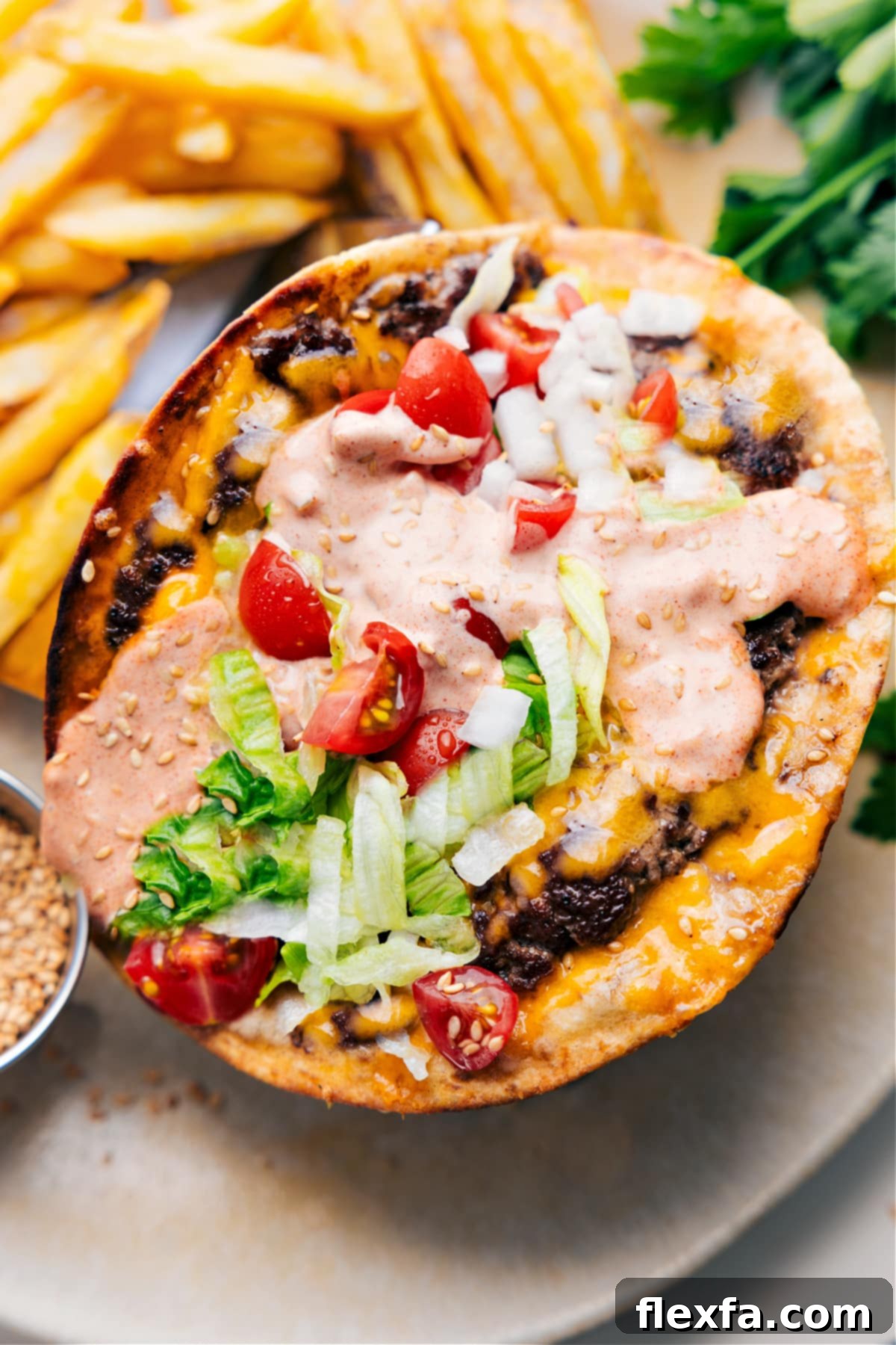 Delicious Smash Burger Tacos loaded with special sauce, fresh shredded iceberg lettuce, and tangy dill pickles, showcasing their crispy beef edges and gloriously melted cheese.