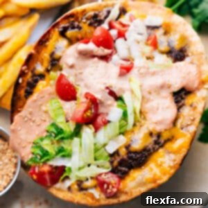 A perfectly cooked Smash Burger Taco, featuring a golden brown, crispy tortilla, a flavorful beef patty, and beautifully melted cheese, garnished and ready for toppings.