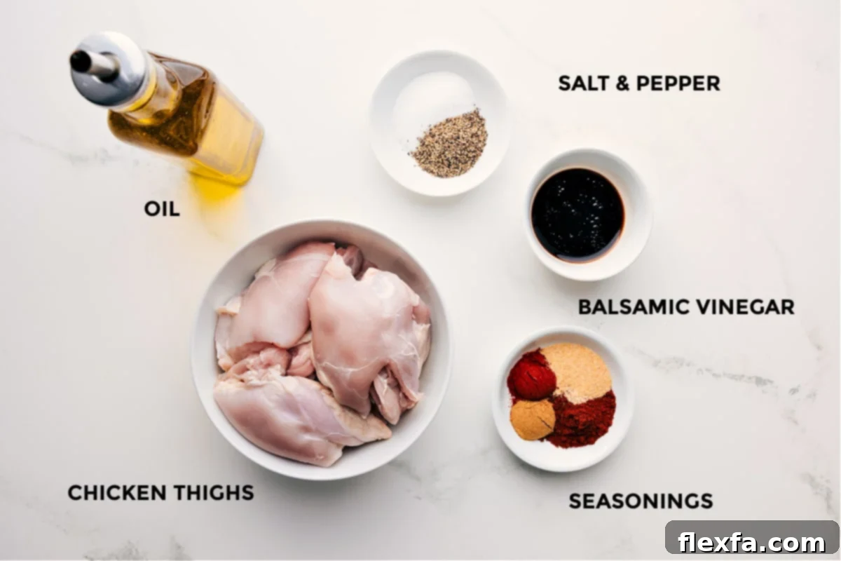 Ingredients In Baked Chicken Thighs All the essential ingredients laid out for preparing baked chicken thighs, including olive oil, boneless thighs, a blend of seasonings, and balsamic vinegar.