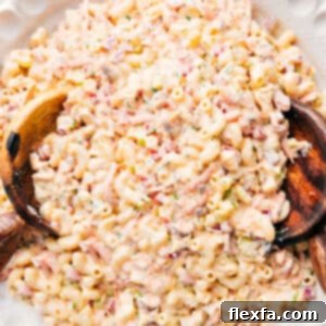 Close-up of creamy Chicken Macaroni Salad in a large bowl, ready for serving.