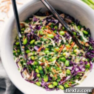 Delicious Asian Slaw with creamy dressing in a small bowl, garnished with fresh cilantro.