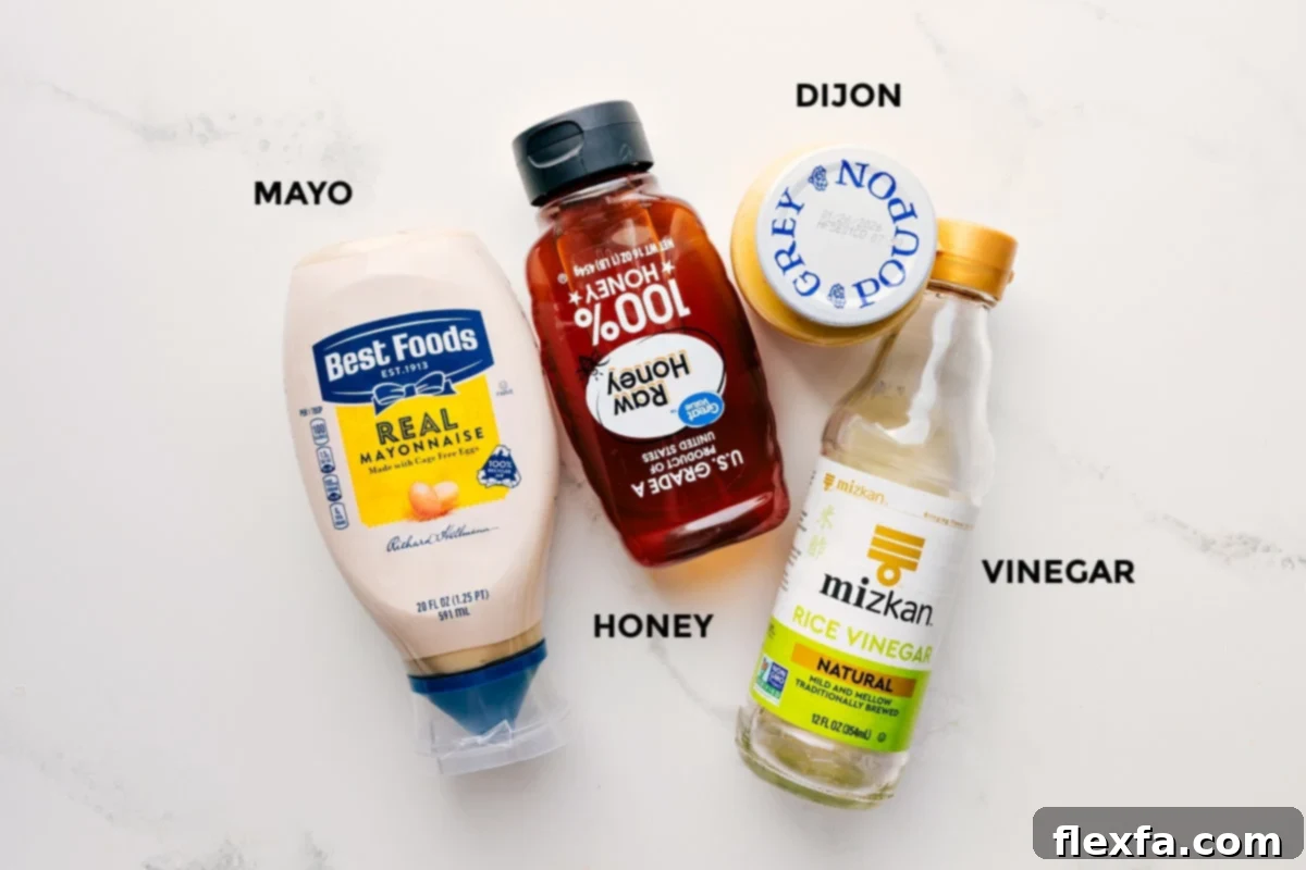 The dressing ingredients for Asian Slaw Recipe prepped out for easy assembly including mayonnaise, honey, rice vinegar, Dijon mustard, salt, and pepper.