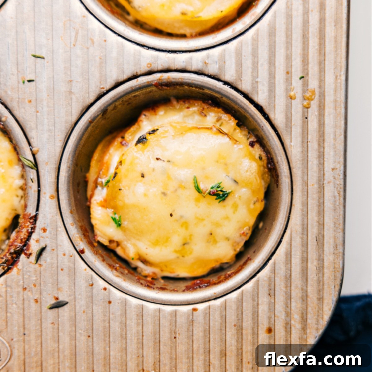 Potato stacks recipe baked golden brown in a muffin tin, ready to be served as a delicious side dish or appetizer.