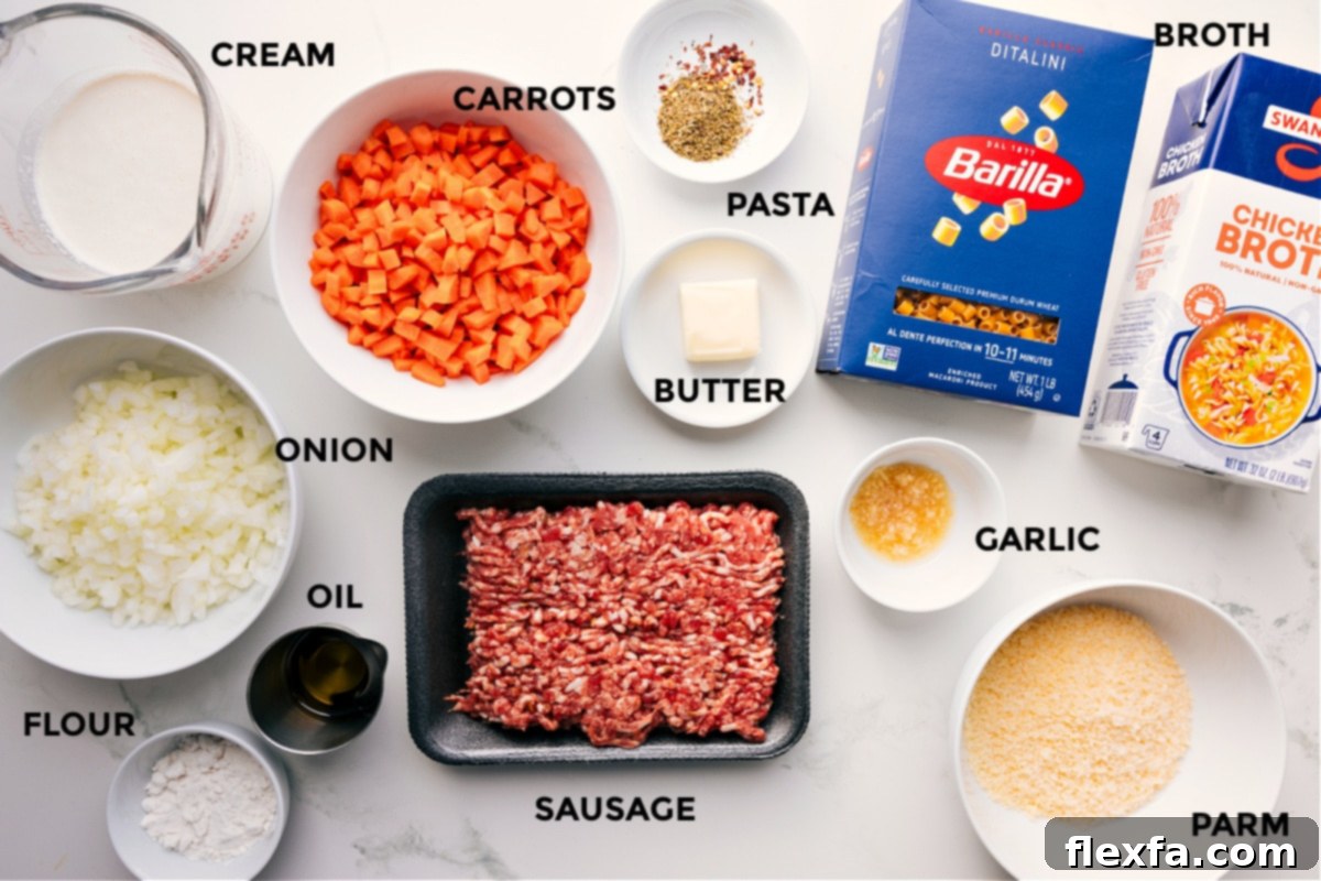 Essential Ingredients for Creamy Parmesan Italian Sausage Soup All the fresh ingredients laid out for Creamy Parmesan Italian Sausage Soup, including cream, various vegetables like carrots and onions, flour, olive oil, Italian sausage, ditalini pasta, butter, minced garlic, a block of Parmesan cheese, and chicken broth.
