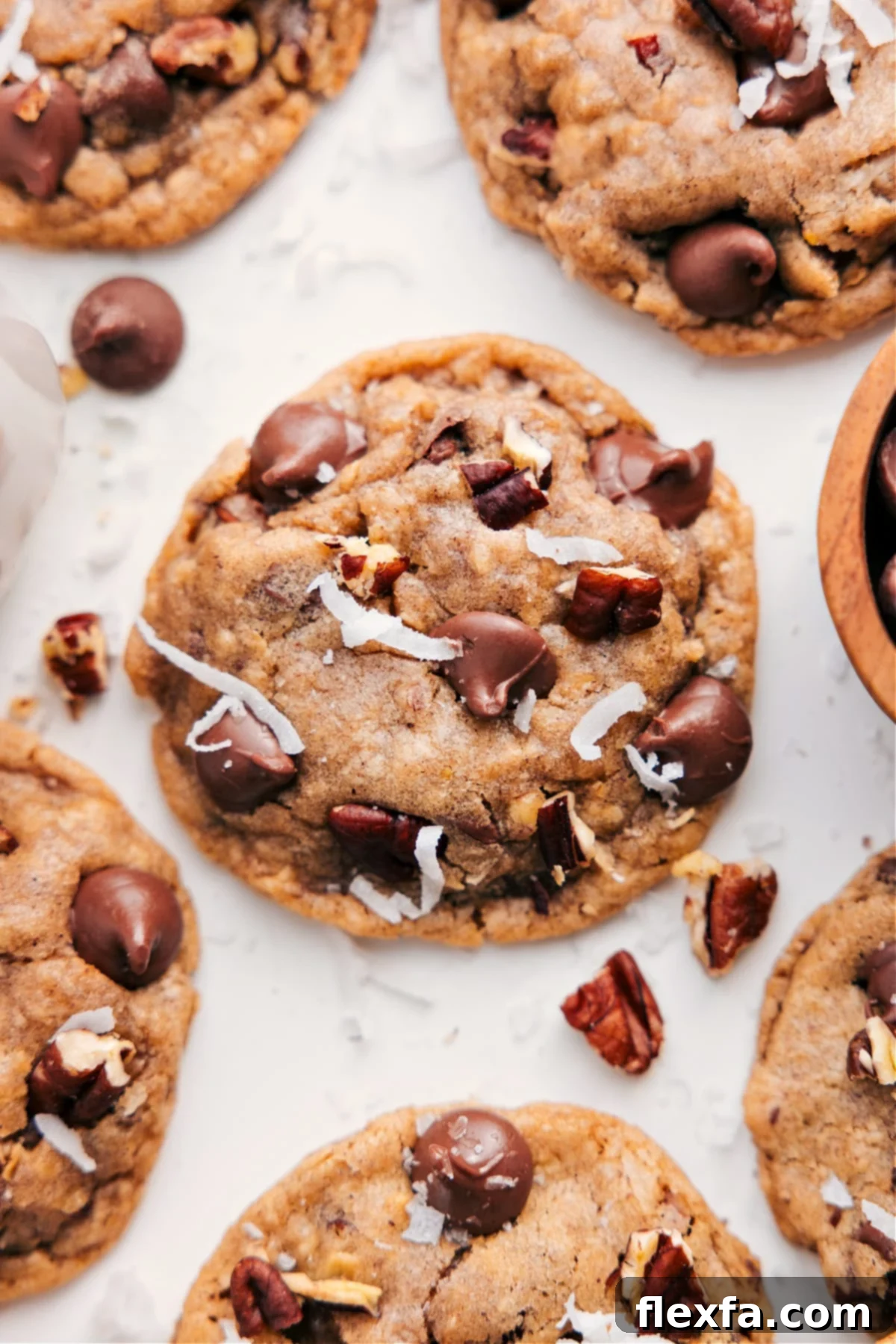 Freshly baked Cowboy Cookies with glistening chocolate chips and toasted coconut, ready to be devoured.