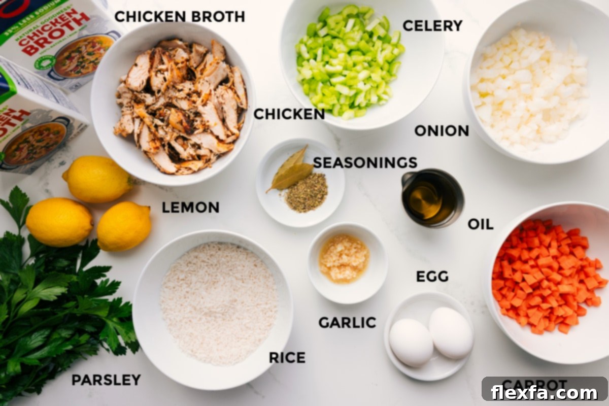 An array of fresh, prepped ingredients for Greek Lemon Soup, including chicken broth, lemons, fresh parsley, uncooked white rice, shredded chicken, various spices, diced celery, onion, carrots, olive oil, eggs, and minced garlic.
