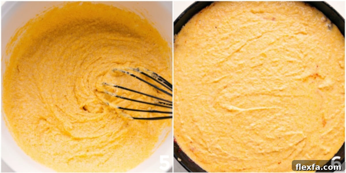 The golden cornbread batter freshly whisked in a bowl, then gently poured over the simmering chili base in a cast iron skillet, ready for baking into a delicious cornbread casserole.