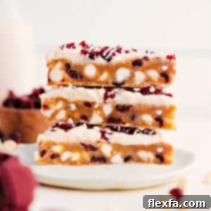 Cranberry Bliss Bars with creamy white frosting and orange zest.