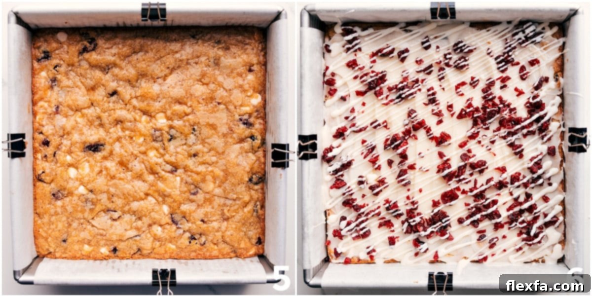 The baked Cranberry Bliss Bars, generously topped with white chocolate frosting, fresh cranberries, and a delicate white chocolate drizzle.