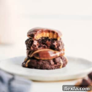 A freshly baked Buckeye Brownie Cookie with a perfect peanut butter center and a chocolate drizzle.