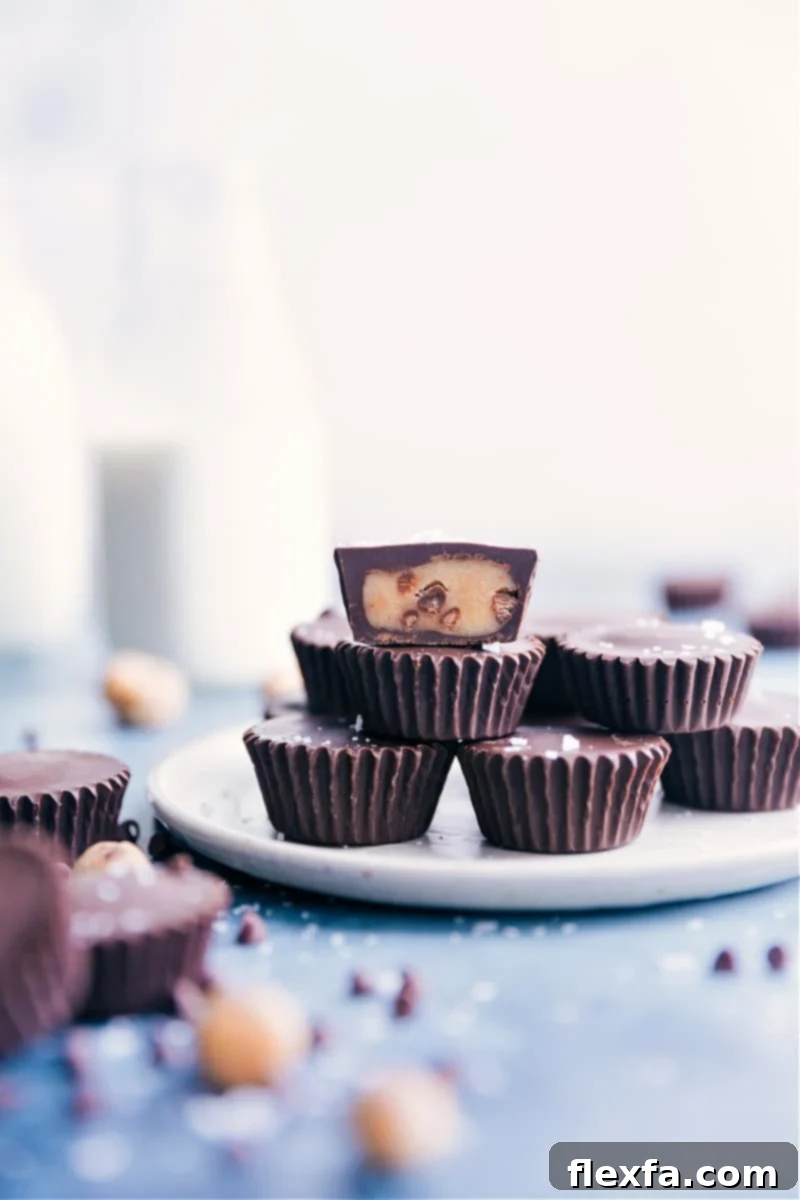 Irresistible Cookie Dough Cups: Edible cookie dough in miniature muffin tin with melted chocolate. A dream for cookie dough lovers! Delicious chocolate-covered edible cookie dough cups in a mini muffin tin, topped with flaky salt, showcasing a perfect no-bake dessert for cookie dough lovers.