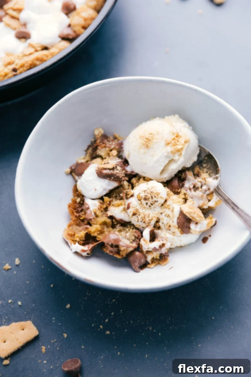 Perfect Dessert Duo: S'mores Pizookie with Ice Cream in a Bowl S'mores pizookie in a bowl, topped with ice cream, a perfect blend of warm cookie and cold ice cream.