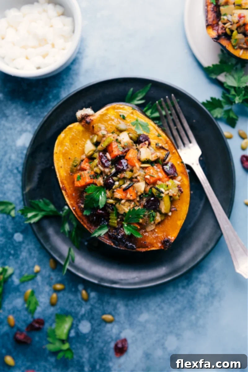 Delicious Stuffed Acorn Squash with wild rice, sweet potatoes, and apples, garnished with fresh parsley, ready to be served.