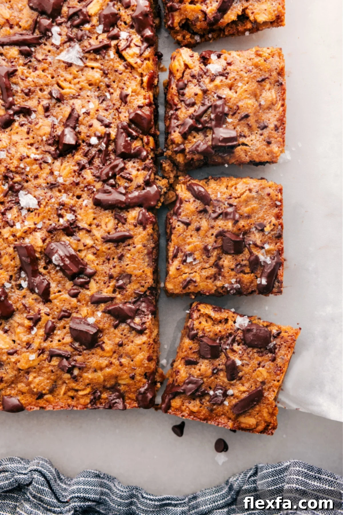 The Perfect Healthy Bars For Breakfast Perfectly baked Soft-Baked Oatmeal Breakfast Bars, fresh from the oven, cut into squares, and ready to enjoy as a wholesome and satisfying snack.