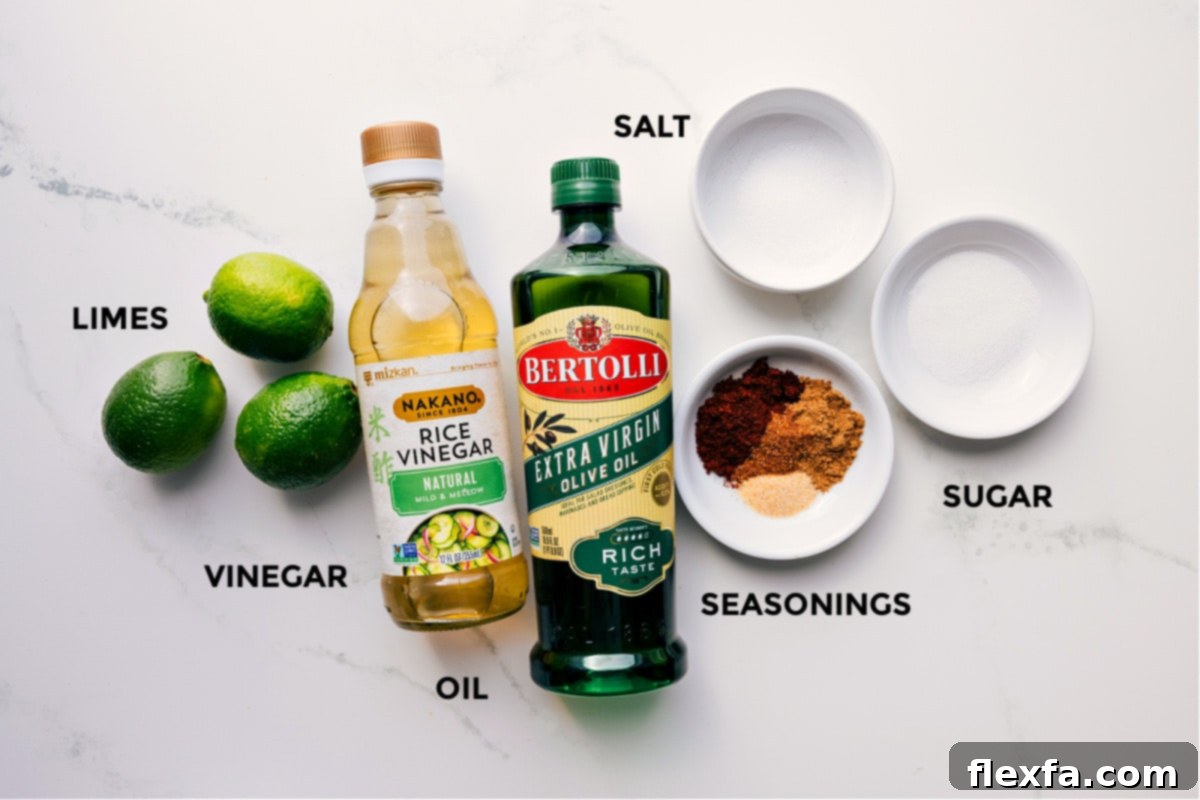 Key Ingredients for Our Zesty Chili-Lime Dressing All the fresh ingredients for the zesty chili-lime dressing laid out on a clean surface: whole limes, a bowl of freshly squeezed lime juice, a bottle of rice vinegar, olive oil, granulated sugar, garlic powder, chili powder, cumin, cayenne pepper, and salt.