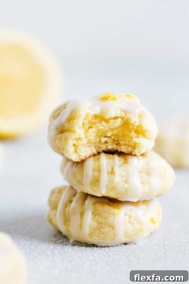 Ready-to-Enjoy Sweet and Zingy Dessert with Glaze on Top Finished dessert: a vibrant lemon cheesecake cookie, sweet and zingy with a generous glaze on top, ready to be enjoyed as a delightful treat.