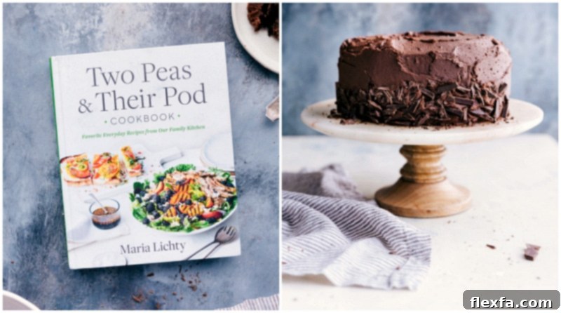 The finished three-layer chocolate cake on a stand next to the Two Peas & Their Pod cookbook, highlighting the recipe's origin.
