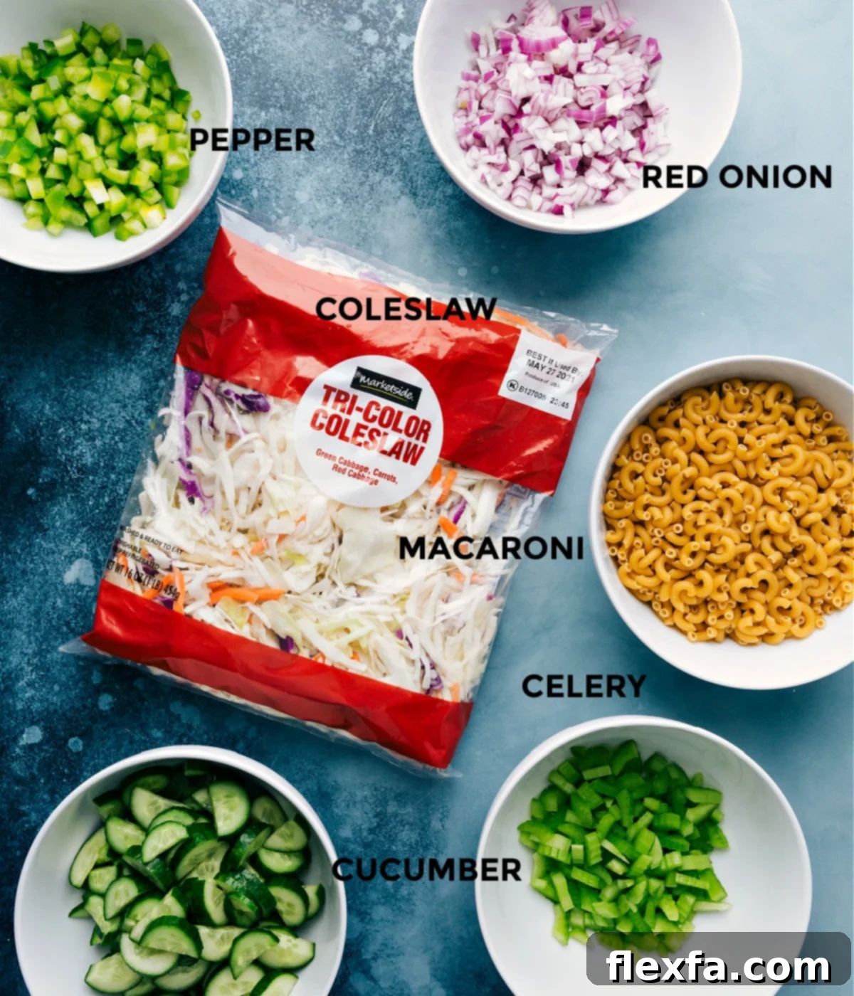 All the fresh ingredients prepped and laid out for easy assembly of Macaroni Coleslaw Salad.