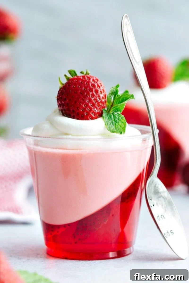The coolest and easiest hack to make these slanted strawberry jell-o parfait cups with a strawberry mousse on top. Delicious and so easy to make and perfect for any celebration!