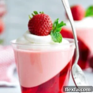 Double-layered Strawberry Jello Parfait Cups with Jello on the bottom and a creamy strawberry mousse on top.