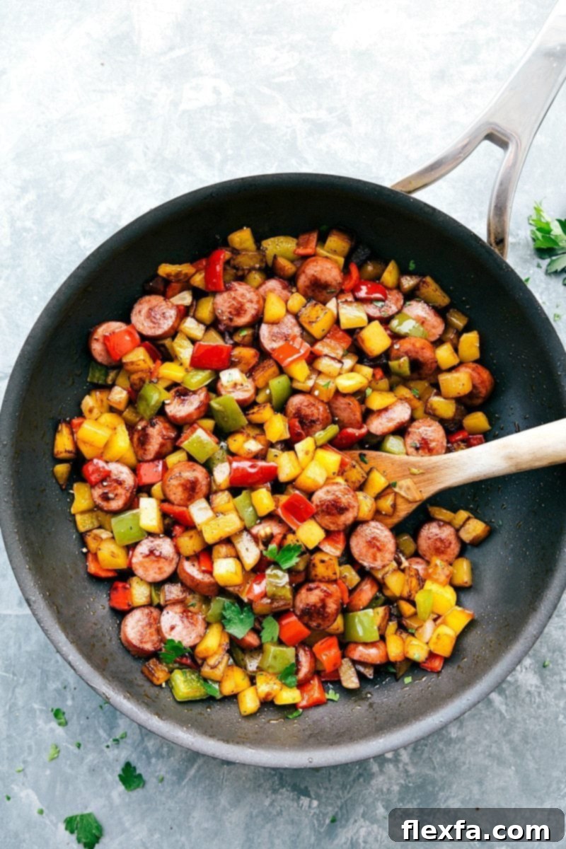 The BEST smoked sausage and veggie breakfast Hash! Great with and without eggs! Recipe from chelseasmessyapron.com